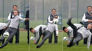 De terno e gravata, David Beckham leva tombo memorável ao tentar chutar bola - Reuters