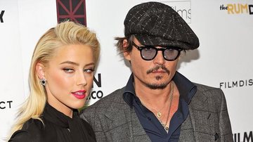 Amber Heard e Johnny Depp na première de 'The Rum Diary' em Nova York - Getty Images