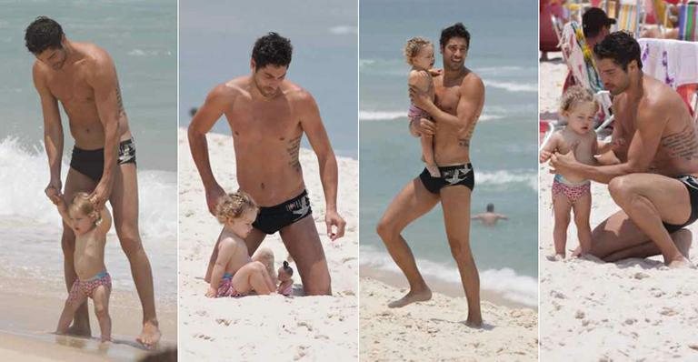 Victor Pecoraro brinca com a filha em praia carioca - Ag.News