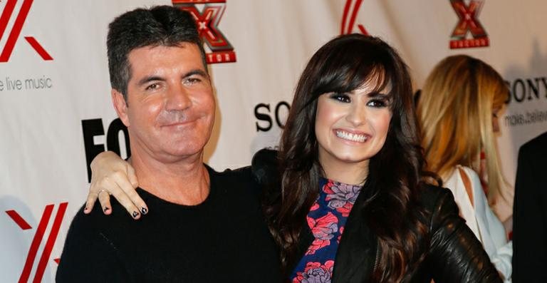 Demi Lovato e Simon Cowell - Getty Images