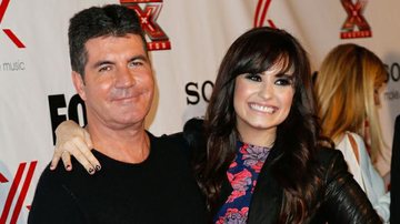 Demi Lovato e Simon Cowell - Getty Images